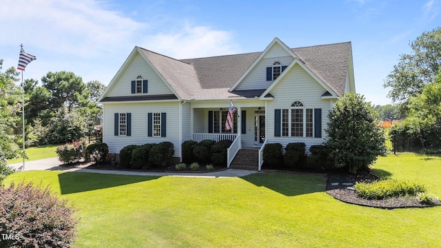 2813 Greenridge View Ln, Zebulon, NC 27597 - traditional home featuring a porch, a front lawn, and a shingled roof