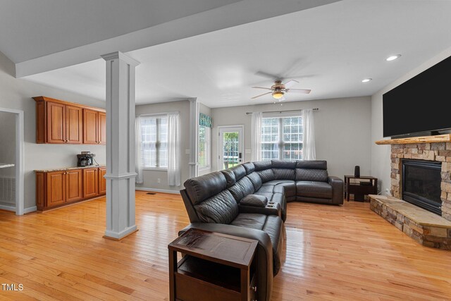 2813 Greenridge View Ln, Zebulon, NC 27597 - living area with ornate columns, light wood-style floors, plenty of natural light, and recessed lighting