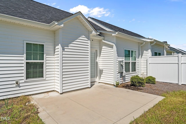 310 Oak Pointe Cir E, Lumberton, NC 28358 - back of house featuring a patio area and roof with shingles