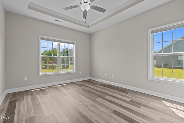 310 Oak Pointe Cir E, Lumberton, NC 28358 - unfurnished room featuring a tray ceiling, wood finished floors, crown molding, and a ceiling fan