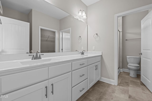 310 Oak Pointe Cir E, Lumberton, NC 28358 - full bath with double vanity, a stall shower, and a spacious closet