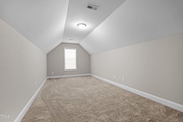 310 Oak Pointe Cir E, Lumberton, NC 28358 - additional living space with carpet flooring and vaulted ceiling