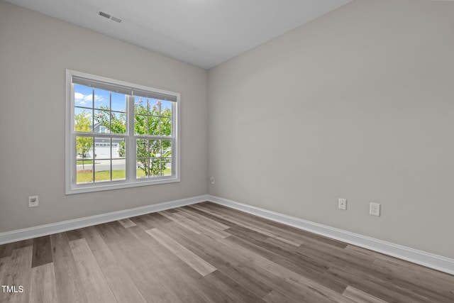 310 Oak Pointe Cir E, Lumberton, NC 28358 - unfurnished room with dark wood-style flooring and baseboards
