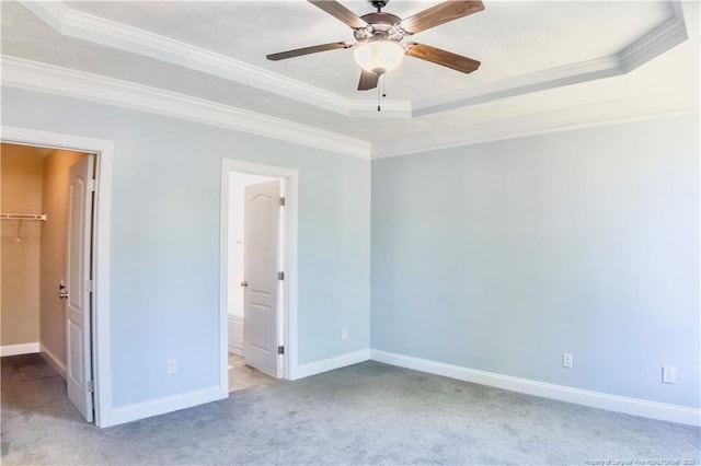 37 Annapolis Rd, Cameron, NC 28326 - unfurnished bedroom featuring a raised ceiling, a walk in closet, carpet, ornamental molding, and connected bathroom