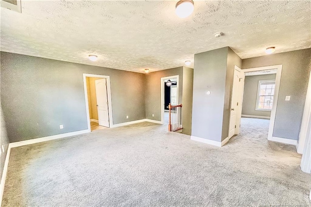 37 Annapolis Rd, Cameron, NC 28326 - empty room featuring light carpet, a textured ceiling, and a smoke detector
