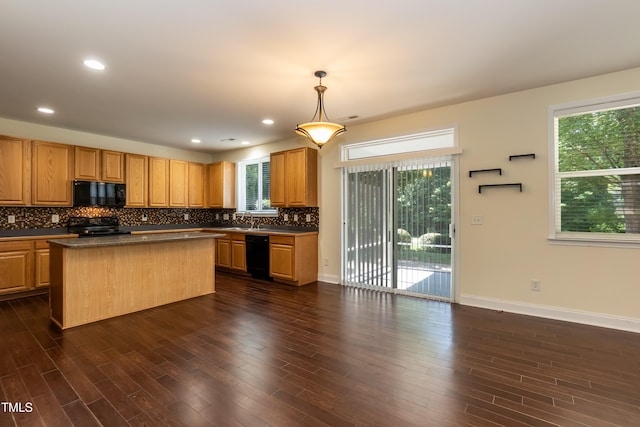 418 Byrams Ford Dr, Cary, NC 27513 - kitchen with black appliances, dark countertops, backsplash, dark wood finished floors, and recessed lighting