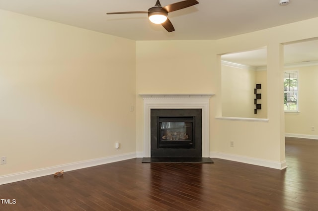 418 Byrams Ford Dr, Cary, NC 27513 - unfurnished living room with dark wood-style flooring, a ceiling fan, and a glass covered fireplace