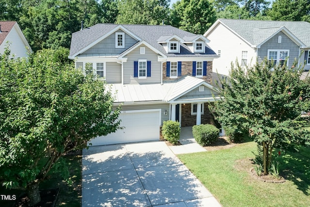 418 Byrams Ford Dr, Cary, NC 27513 - craftsman-style home featuring stone siding, driveway, a standing seam roof, a front lawn, and a metal roof