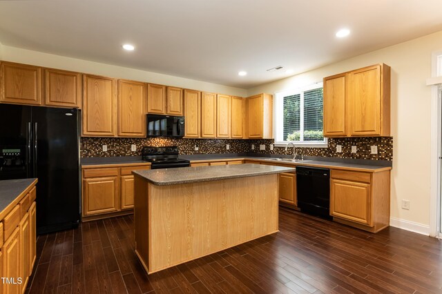 418 Byrams Ford Dr, Cary, NC 27513 - kitchen with black appliances, a kitchen island, dark wood-style floors, backsplash, and recessed lighting