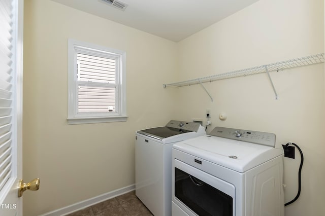418 Byrams Ford Dr, Cary, NC 27513 - laundry room with washing machine and clothes dryer and dark tile patterned floors