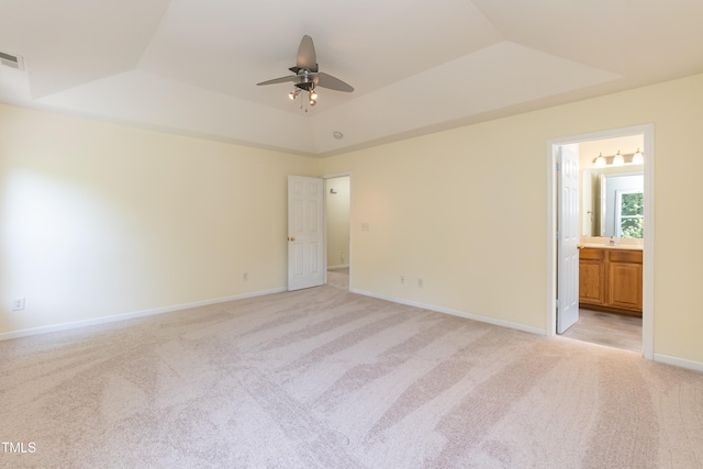 418 Byrams Ford Dr, Cary, NC 27513 - unfurnished bedroom featuring a raised ceiling, light colored carpet, and ensuite bathroom