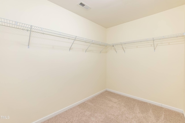418 Byrams Ford Dr, Cary, NC 27513 - walk in closet featuring light colored carpet