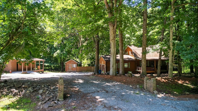 3263 S Jim Minor Rd, Haw River, NC 27258 - view of front of home featuring a storage shed and a porch