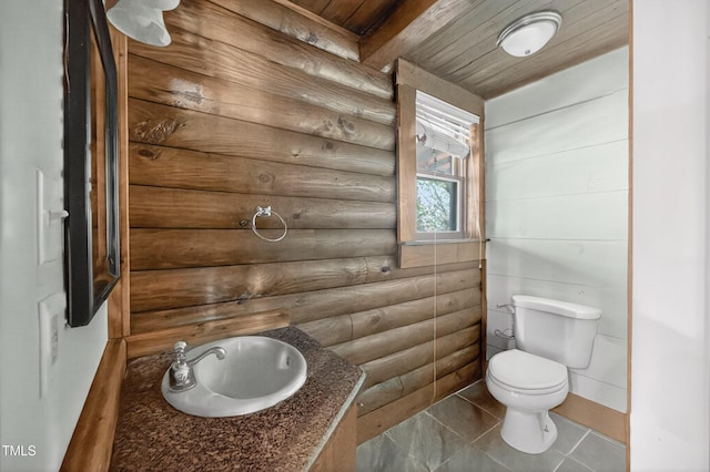 3263 S Jim Minor Rd, Haw River, NC 27258 - half bath featuring rustic walls, a wooden ceiling with exposed beams, and tile patterned flooring