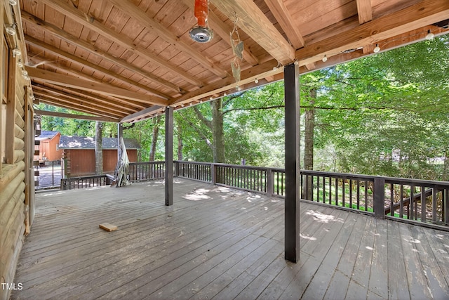 3263 S Jim Minor Rd, Haw River, NC 27258 - deck with a storage unit and view of wooded area