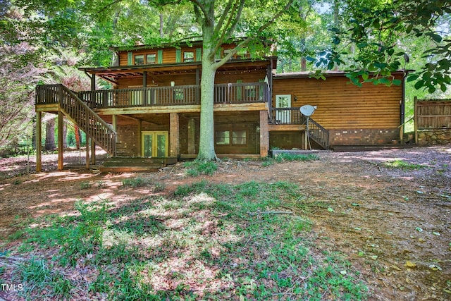 3263 S Jim Minor Rd, Haw River, NC 27258 - back of property featuring stairway, a wooden deck, and french doors