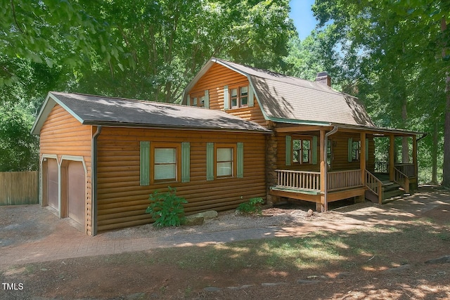 3263 S Jim Minor Rd, Haw River, NC 27258 - rear view of property with a porch, a gambrel roof, a chimney, roof with shingles, and an attached garage
