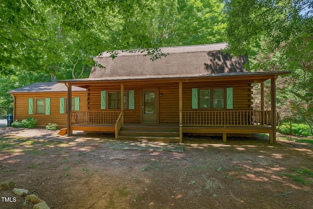 3263 S Jim Minor Rd, Haw River, NC 27258 - log cabin featuring covered porch and log siding