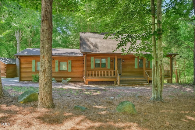 3263 S Jim Minor Rd, Haw River, NC 27258 - view of front of house featuring a porch and roof with shingles