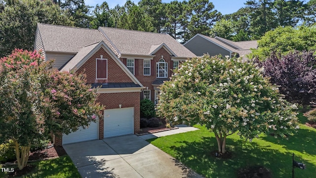 308 Sutton Glen Dr, Apex, NC 27523 - view of front of property featuring brick siding, concrete driveway, a front lawn, a garage, and a shingled roof