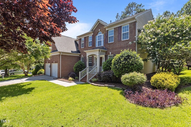 308 Sutton Glen Dr, Apex, NC 27523 - traditional home with brick siding, a front lawn, an attached garage, and driveway