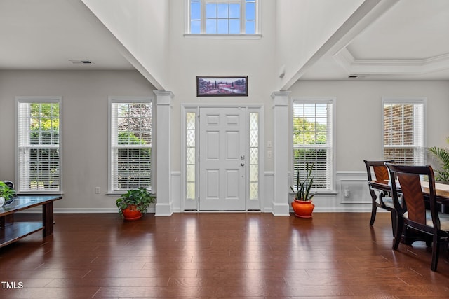 308 Sutton Glen Dr, Apex, NC 27523 - entrance foyer featuring decorative columns, plenty of natural light, and hardwood / wood-style floors