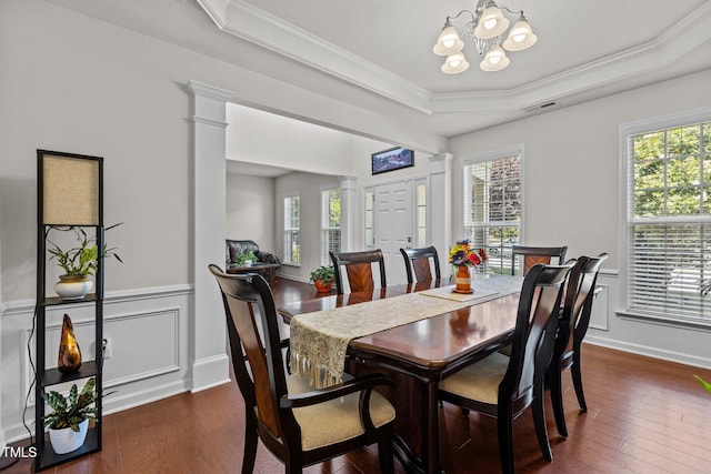 308 Sutton Glen Dr, Apex, NC 27523 - dining area with ornate columns, a raised ceiling, a chandelier, plenty of natural light, and crown molding