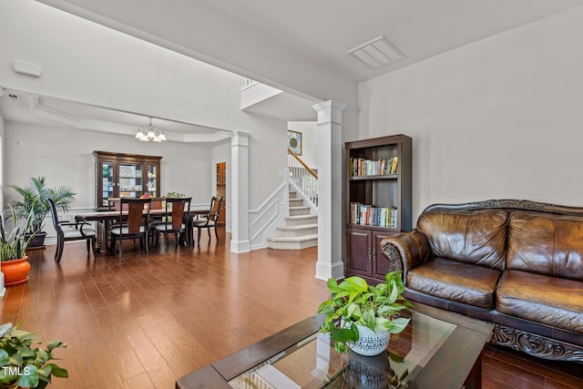 308 Sutton Glen Dr, Apex, NC 27523 - living area featuring ornate columns, a chandelier, wood-type flooring, and stairway