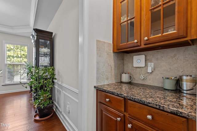 308 Sutton Glen Dr, Apex, NC 27523 - bar area featuring tasteful backsplash, dark wood finished floors, a wainscoted wall, and ornamental molding