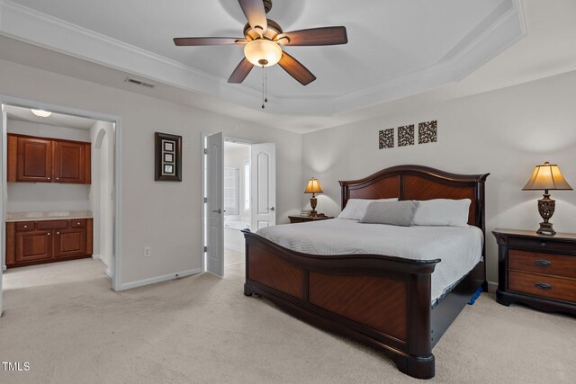 308 Sutton Glen Dr, Apex, NC 27523 - bedroom with a tray ceiling, ensuite bath, light carpet, and crown molding