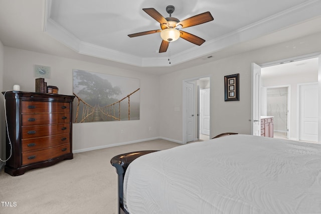 308 Sutton Glen Dr, Apex, NC 27523 - carpeted bedroom with a tray ceiling, ornamental molding, connected bathroom, and ceiling fan
