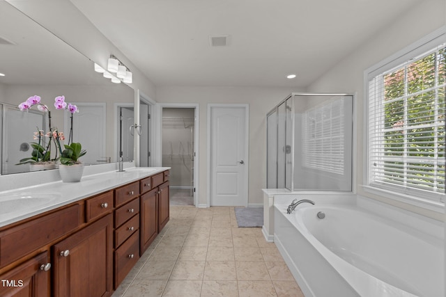 308 Sutton Glen Dr, Apex, NC 27523 - full bathroom with healthy amount of natural light, a shower stall, double vanity, a garden tub, and recessed lighting