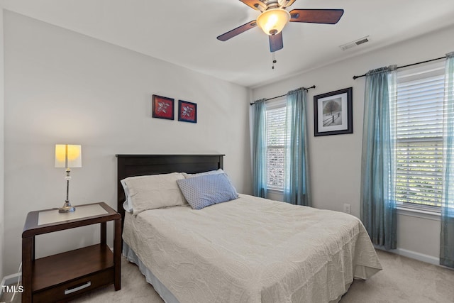 308 Sutton Glen Dr, Apex, NC 27523 - bedroom with light colored carpet, multiple windows, and ceiling fan