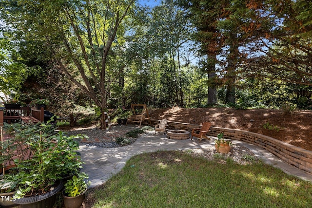 308 Sutton Glen Dr, Apex, NC 27523 - view of yard with a fire pit and a patio
