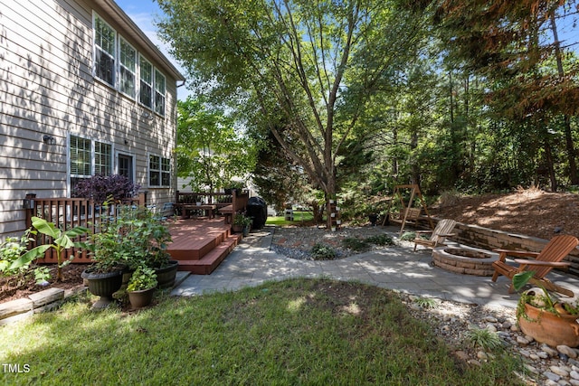 308 Sutton Glen Dr, Apex, NC 27523 - view of yard with an outdoor fire pit, a wooden deck, and a patio
