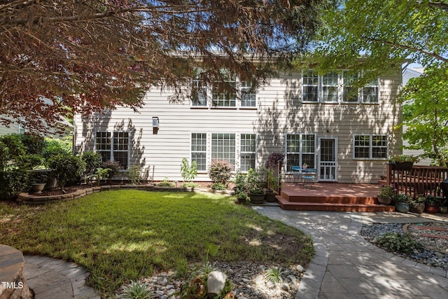 308 Sutton Glen Dr, Apex, NC 27523 - rear view of house featuring a wooden deck and a lawn