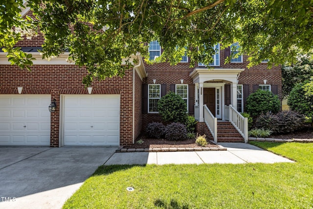 308 Sutton Glen Dr, Apex, NC 27523 - view of front facade featuring concrete driveway, brick siding, and a front yard