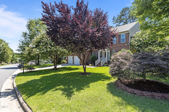 308 Sutton Glen Dr, Apex, NC 27523 - view of front of property with brick siding, a front yard, and a garage