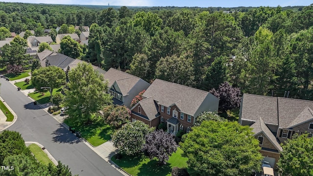 308 Sutton Glen Dr, Apex, NC 27523 - aerial view of residential area featuring a heavily wooded area
