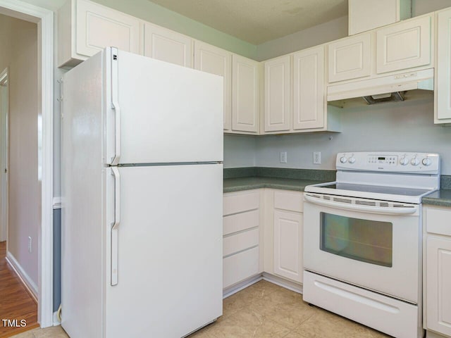 516 Yellow Berry, Wendell, NC 27591 - kitchen featuring white appliances, under cabinet range hood, dark countertops, and white cabinets