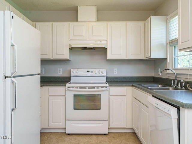516 Yellow Berry, Wendell, NC 27591 - kitchen featuring white appliances, under cabinet range hood, white cabinets, light tile patterned flooring, and dark countertops