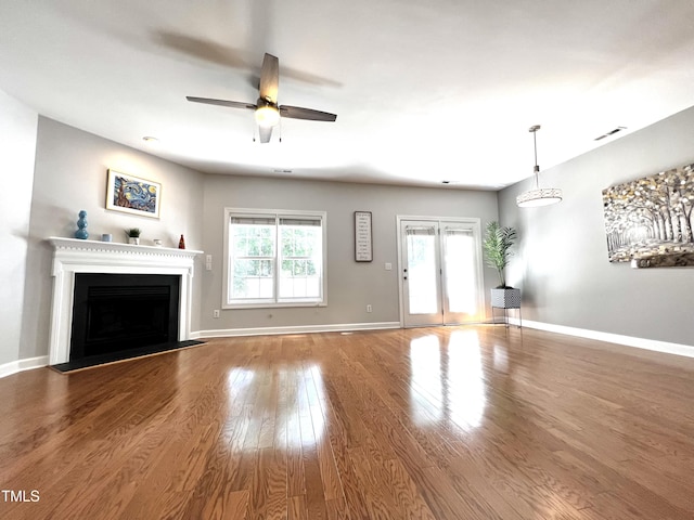 2069 White Pond Ct, Apex, NC 27523 - unfurnished living room with ceiling fan, wood finished floors, and a fireplace