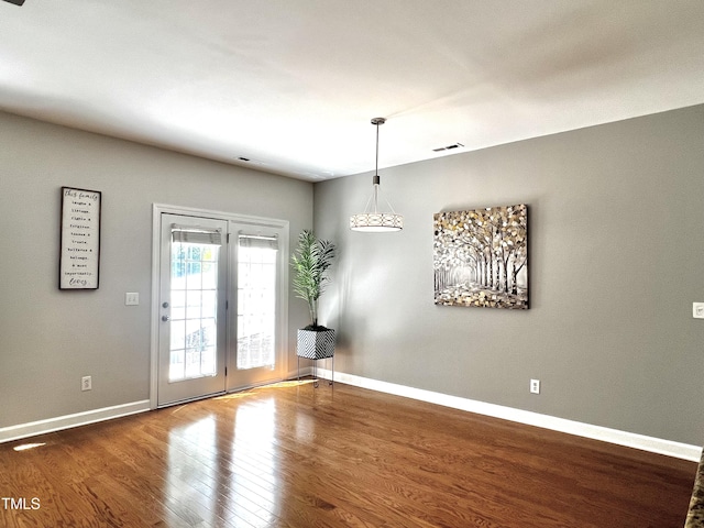2069 White Pond Ct, Apex, NC 27523 - spare room with wood finished floors and baseboards