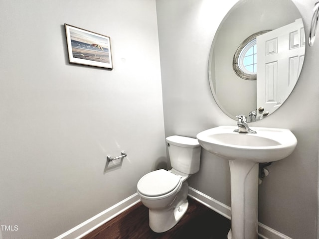 2069 White Pond Ct, Apex, NC 27523 - bathroom featuring baseboards and wood finished floors