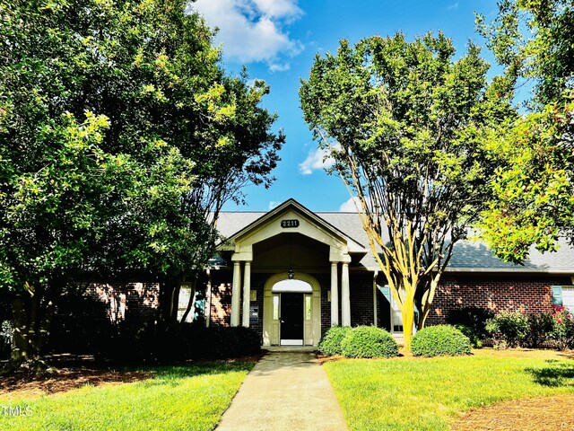 2069 White Pond Ct, Apex, NC 27523 - greek revival house featuring brick siding and a front yard