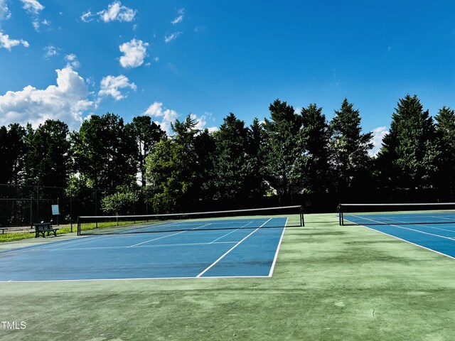 2069 White Pond Ct, Apex, NC 27523 - view of tennis court with view of scattered trees