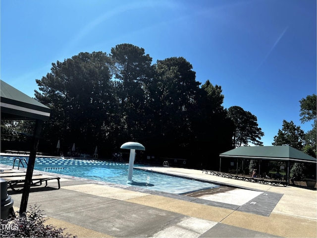 2069 White Pond Ct, Apex, NC 27523 - community pool featuring a patio area