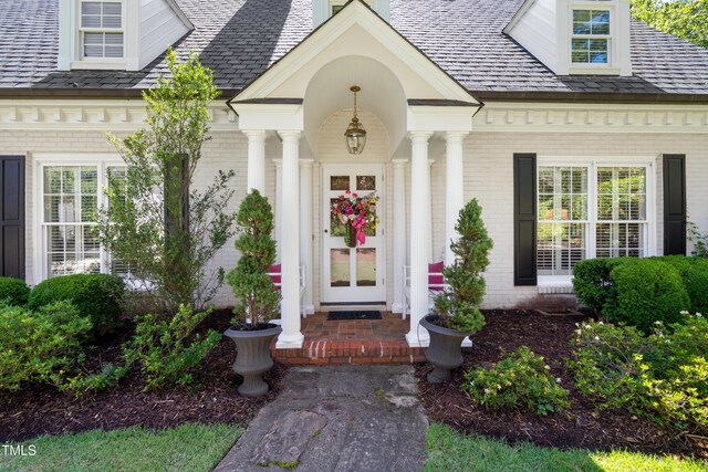 1610 Ridge Rd, Raleigh, NC 27607 - view of exterior entry featuring brick siding and a porch