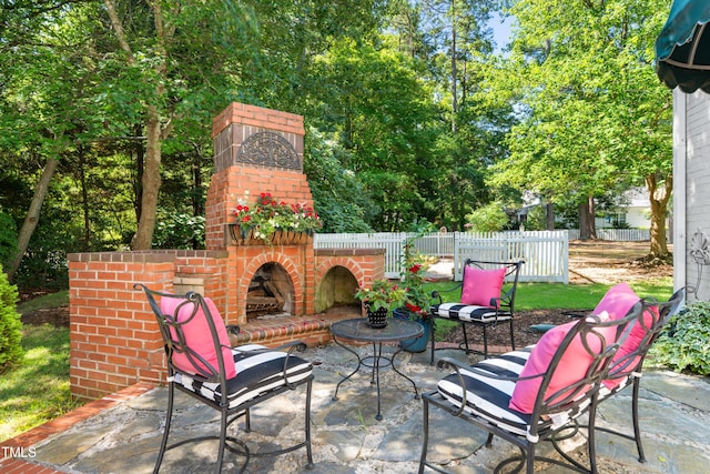 1610 Ridge Rd, Raleigh, NC 27607 - view of patio with an outdoor brick fireplace