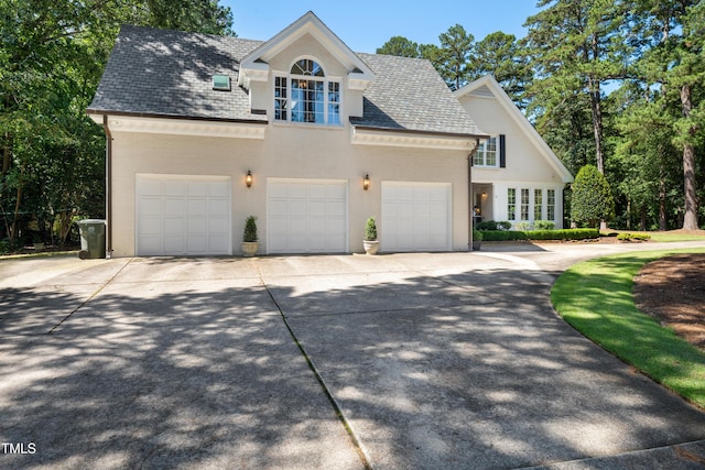 1610 Ridge Rd, Raleigh, NC 27607 - view of front facade featuring brick siding, driveway, a garage, and an attached garage